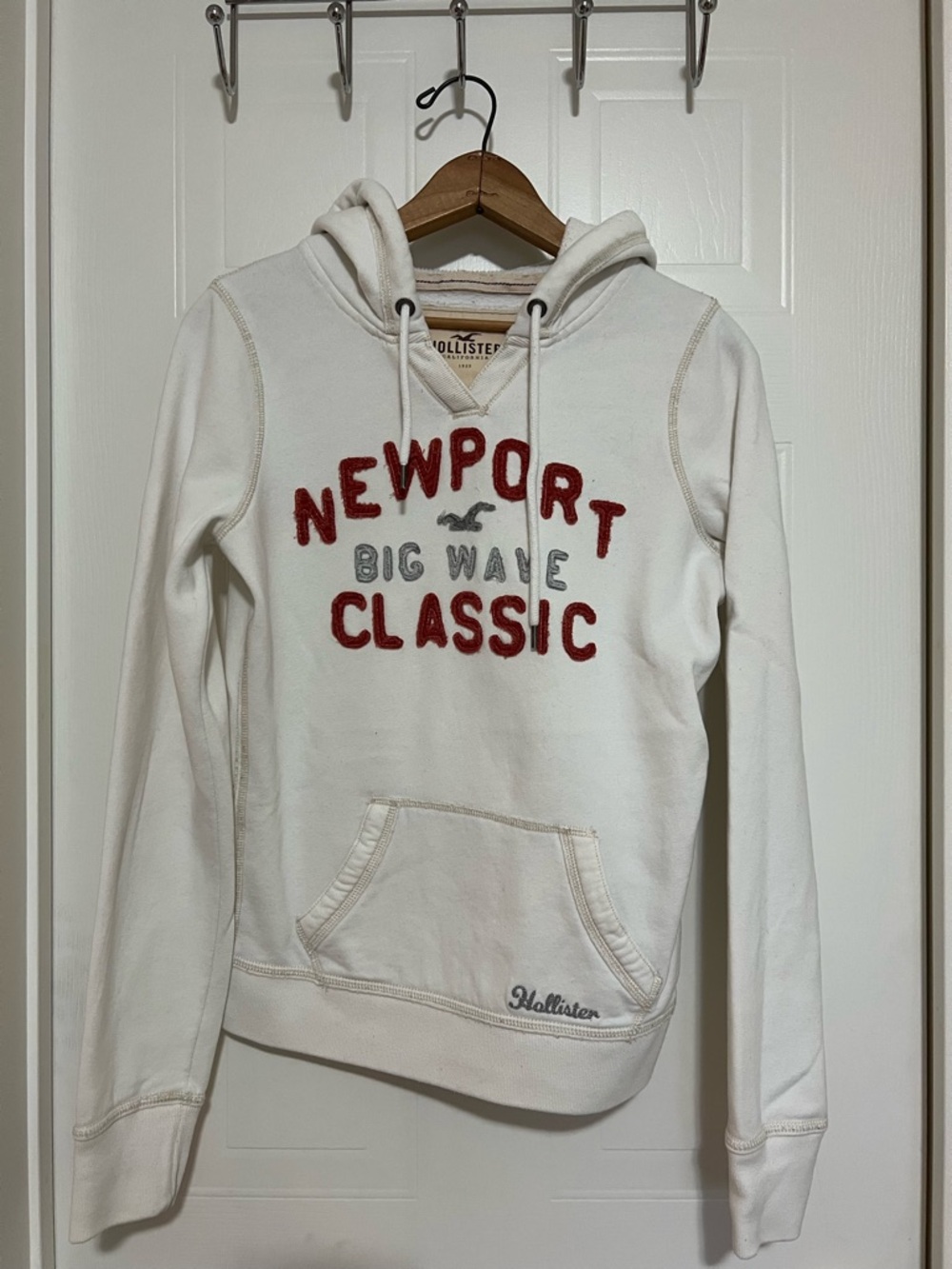 Hollister Cream Hooded Sweatshirt with Red Lettering